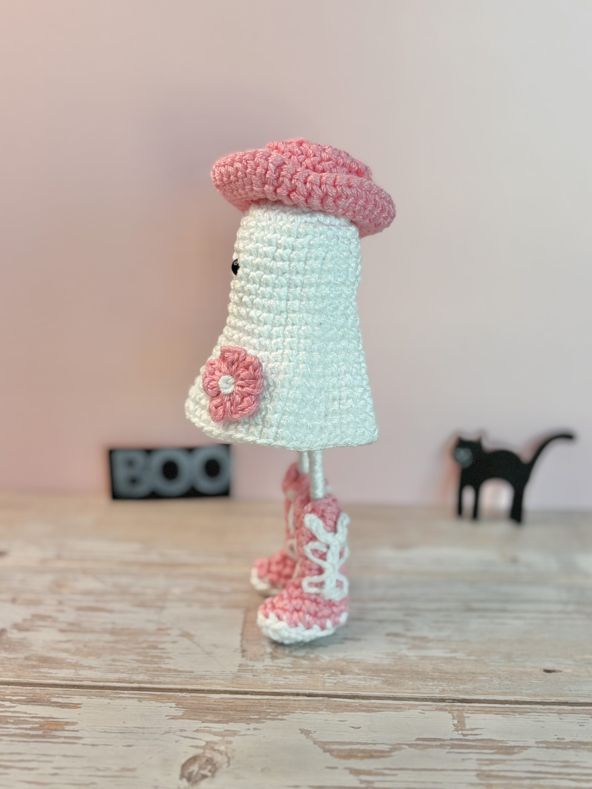 side of crochet cowgirl ghost with pink flower