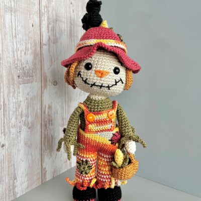 crochet scarecrow with crow on the hat
